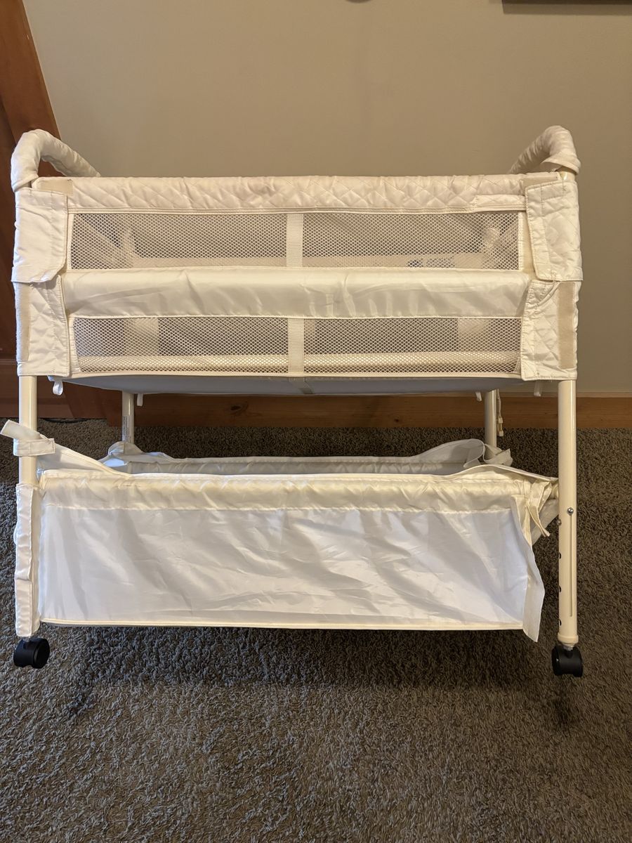 Portable  Creamy White Mesh Baby Bassinet with Storage Basket and Caster Wheels