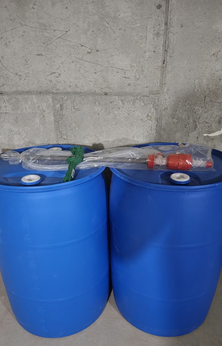 Pair of 55-Gallon Blue Plastic Drums with Siphon Pump Assembly