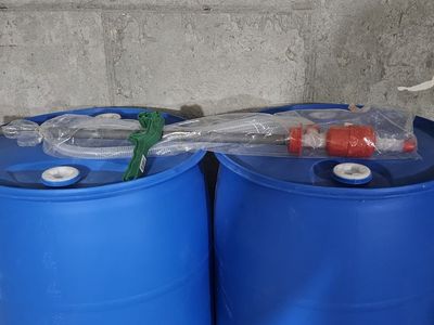 Pair of 55-Gallon Blue Plastic Drums with Siphon Pump Assembly