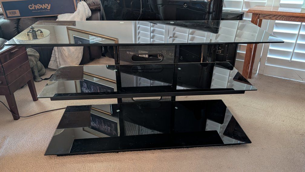 Black glass entertainment center/ tv stand