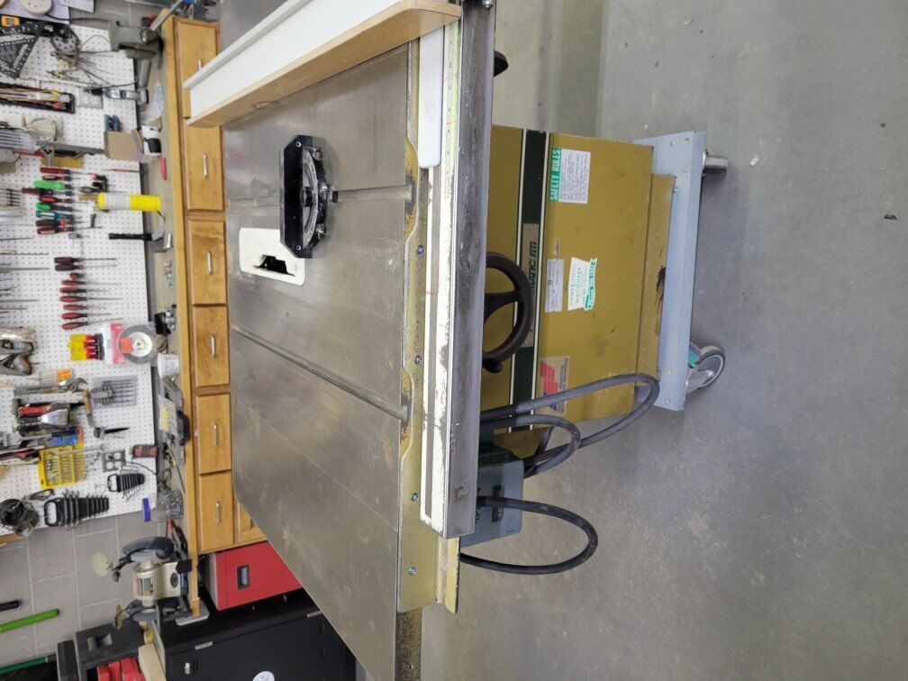 5hp. Powermatic 68 Table saw with 1hp. Power feeder