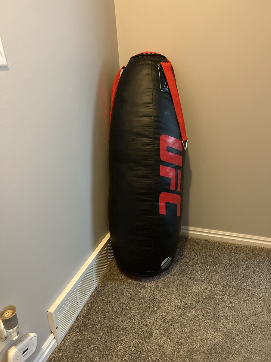 Red UFC punching bag 4ft tall and about 60 pounds