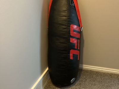 Red UFC punching bag 4ft tall and about 60 pounds