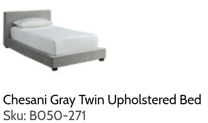 Light Gray Upholstered Twin bed great shape.