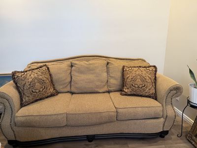 Classic Brown Fabric Sofa Couch with Nailhead Trim & 2 Throw Pillows with dark wood base