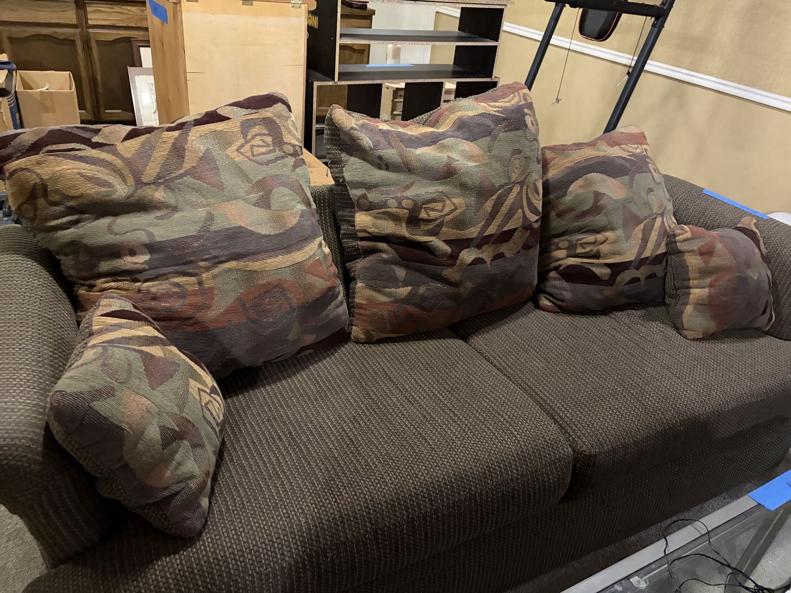 Brown Fabric Couch with Multicolored Patterned Throw Pillows and matching loveseat