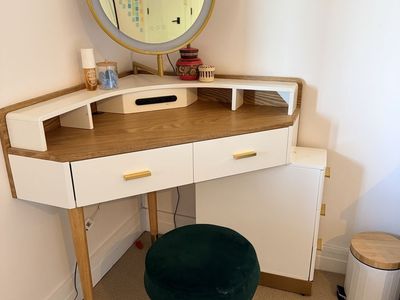 Corner lighted makeup vanity