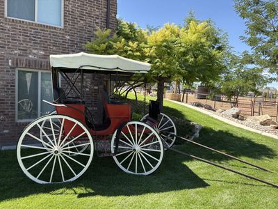 Vintage Red Horse Drawn Carriage Buggy with White Spoke Wheels and Top