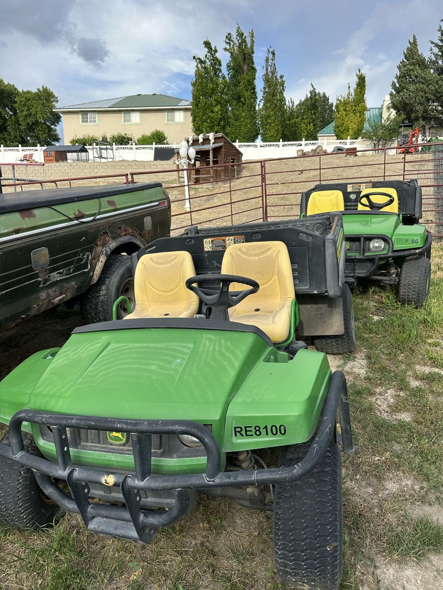 2 John Deere Gators