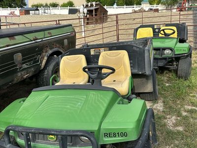 2 John Deere Gators
