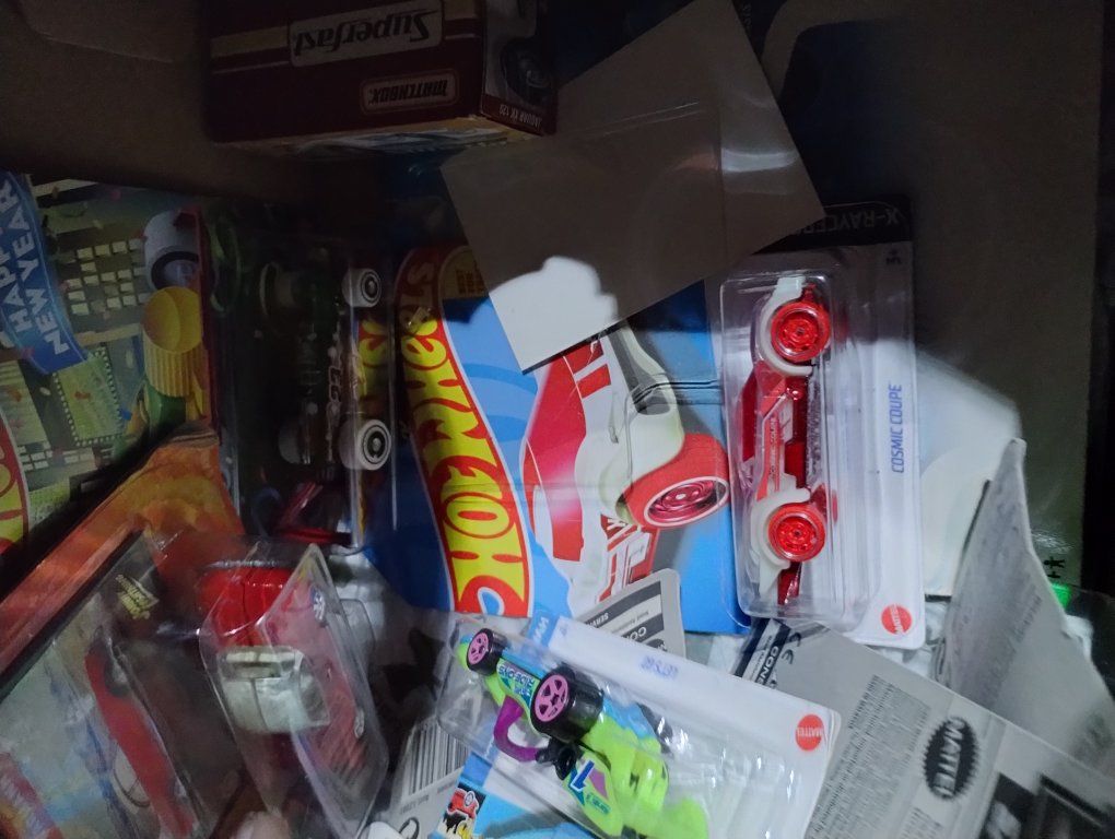 box of hotwheels and matchbox cars