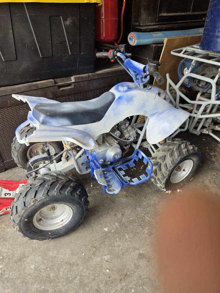 Used 4-Wheeler ATV in Blue and White