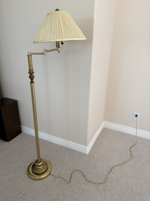 Brass floor lamp with a round base
