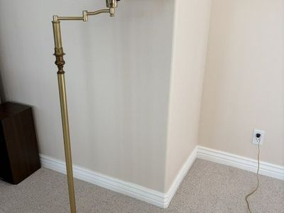 Brass floor lamp with a round base