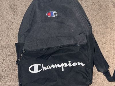 Champion Black and Gray Backpack with Front Script Logo on it