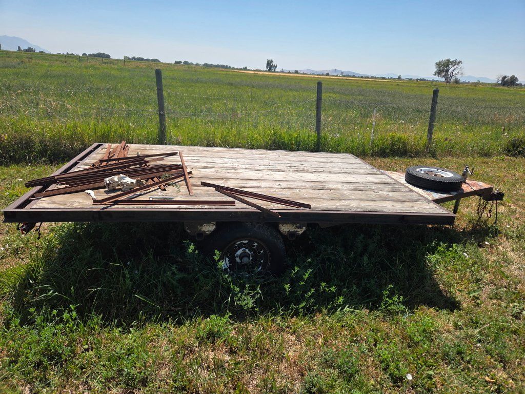 Single Axle Flatbed Utility Trailer with Wood Deck and Spare Tire