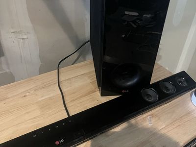 LG Sound Bar + Wireless Subwoofer + Optical Cable