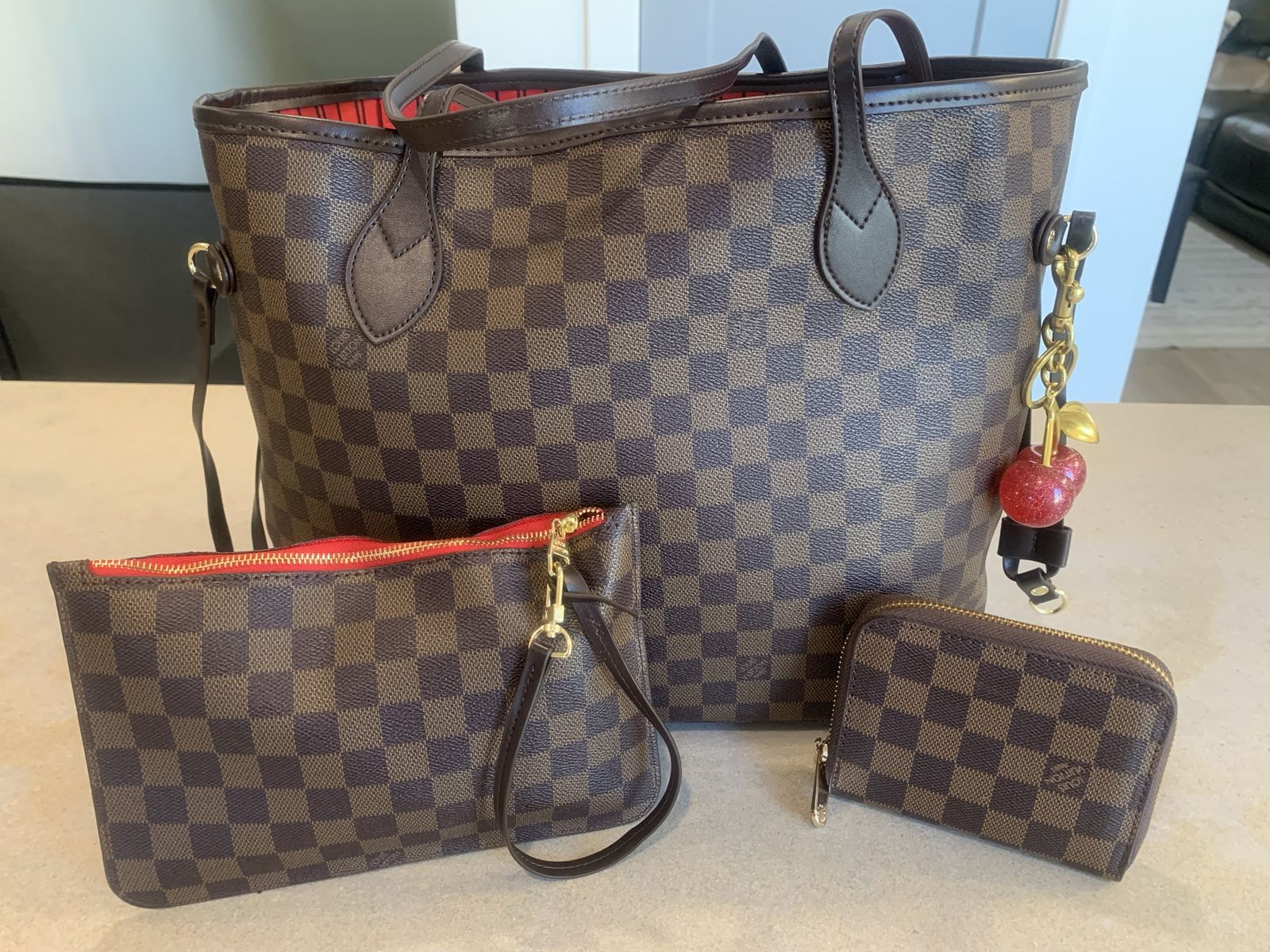 LV never full hand bang and matching purse set cherry purse charm sold separately 