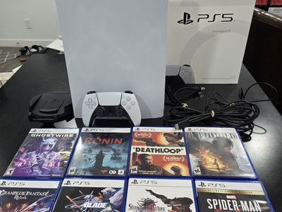 Playstation 5 w/ Brand new controller and 8 games