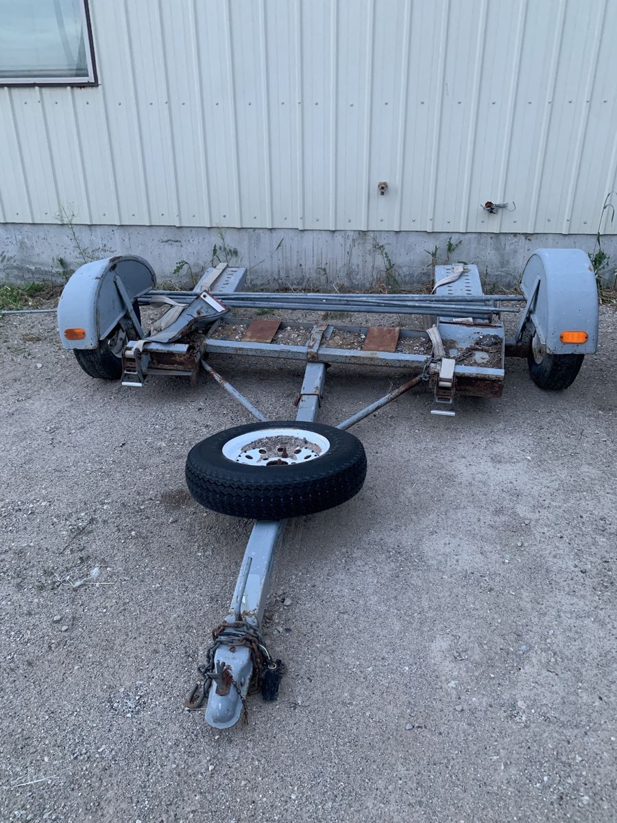 Two wheel  pull behind car dolly, works great, but has a damaged fender