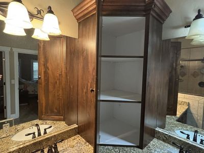 Primary Bathroom Corner Alder Cabinets.