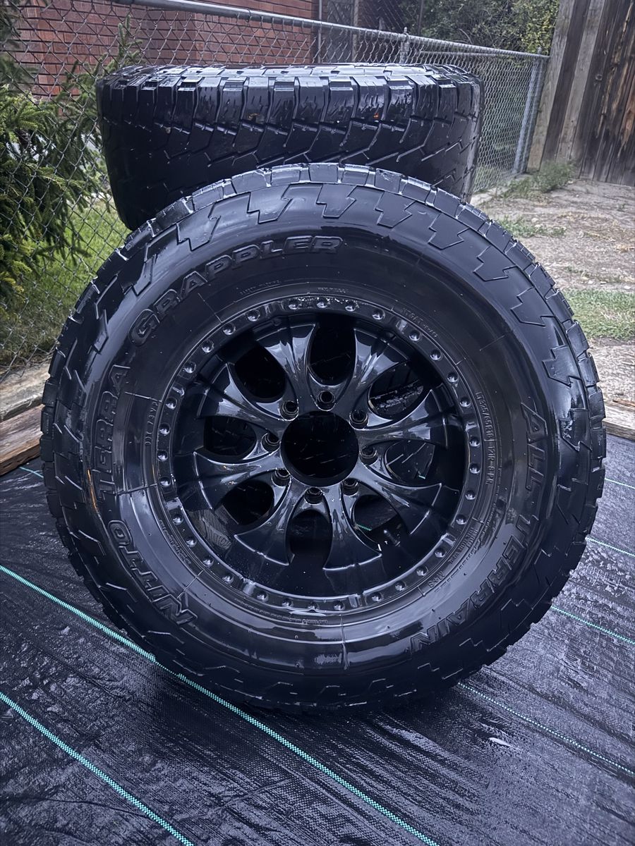 Nitto Terra Grappler All Terrain Tires with Black Rims Set of 4