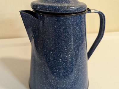 blue and white speckled enamelware coffee pot