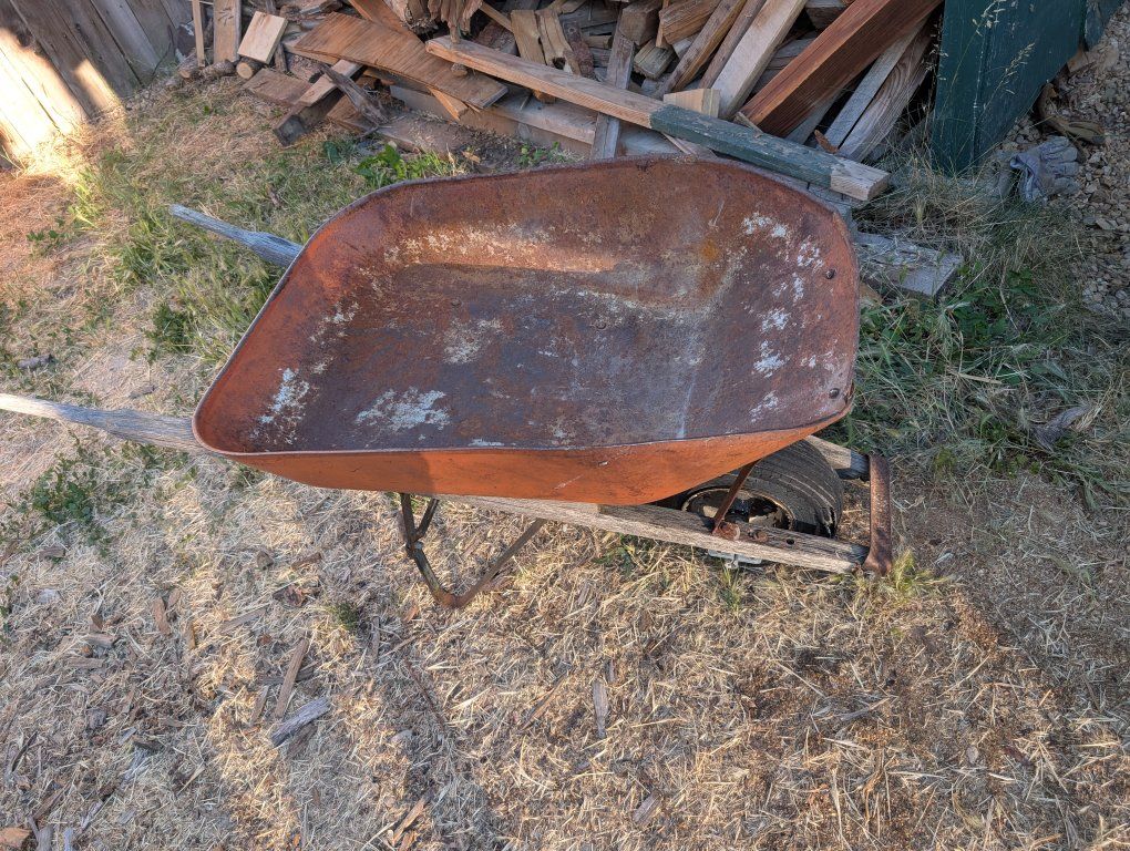 Old wheel barrow for yard art or other.