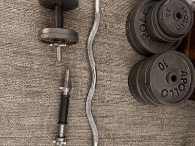Curling bar, dumb bell bars and 145 lbs in weights