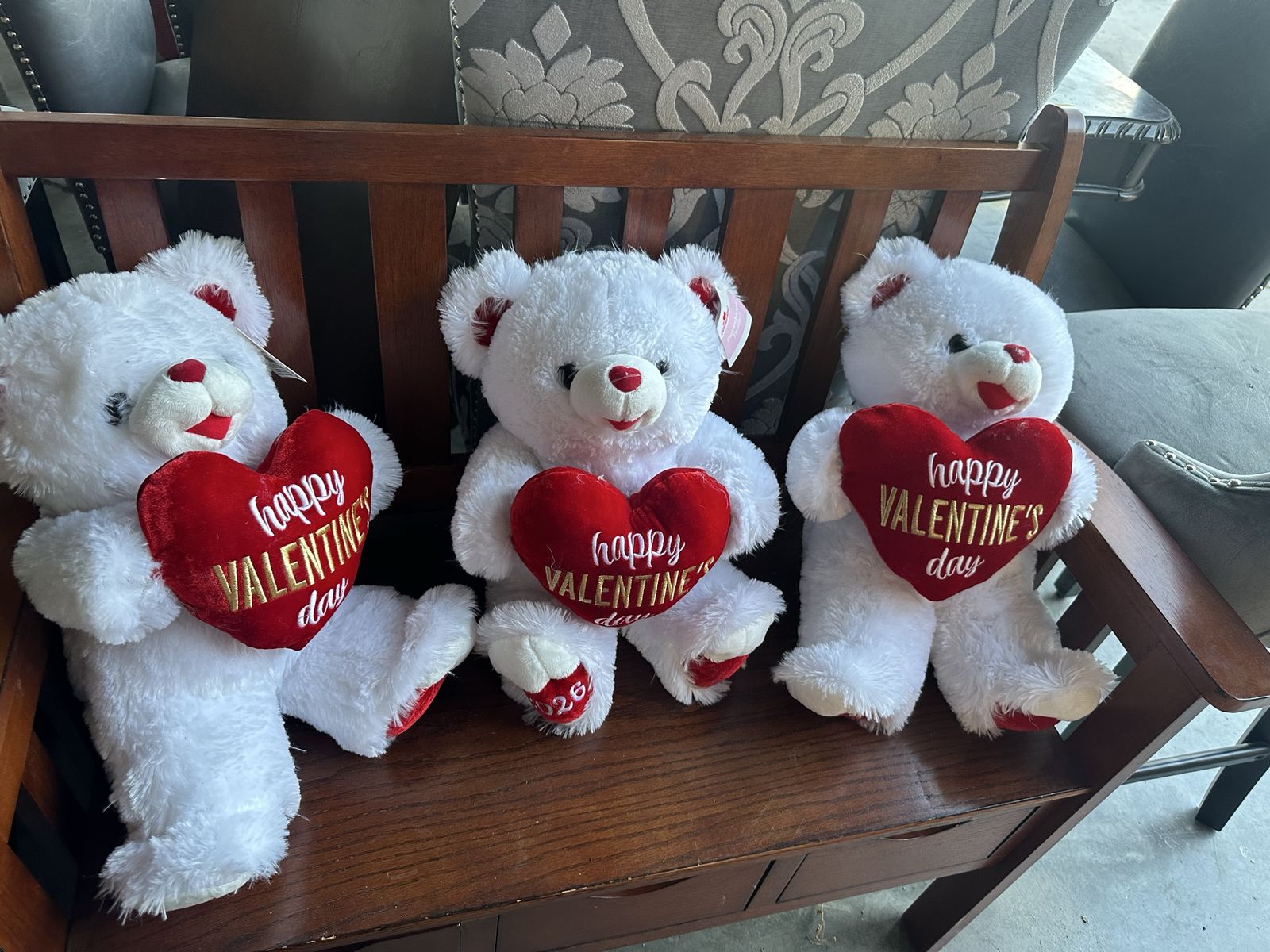 Three White Valentine's Day Teddy Bears Holding Hearts