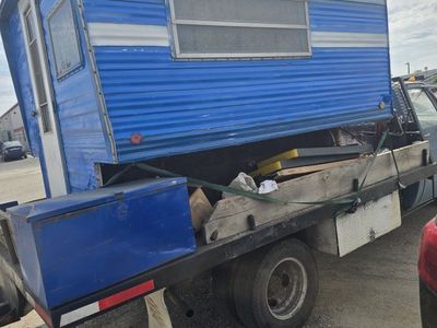 Vintage Blue and White Truck Camper with Interior Dining and Kitchen