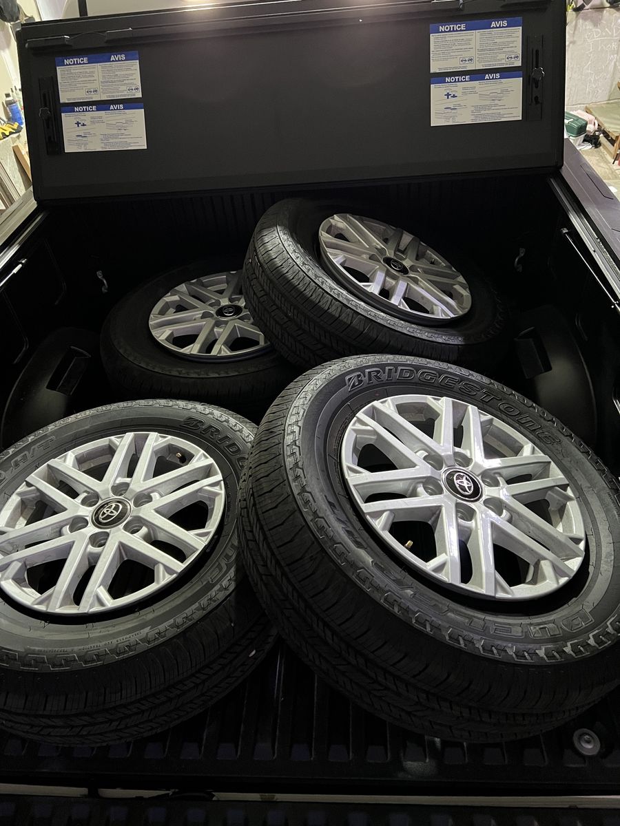 Set of 4 OEM Toyota 18” silver-painted alloy wheels with Bridgestone Dueler H/T tires (265/70R18 116T M+S)