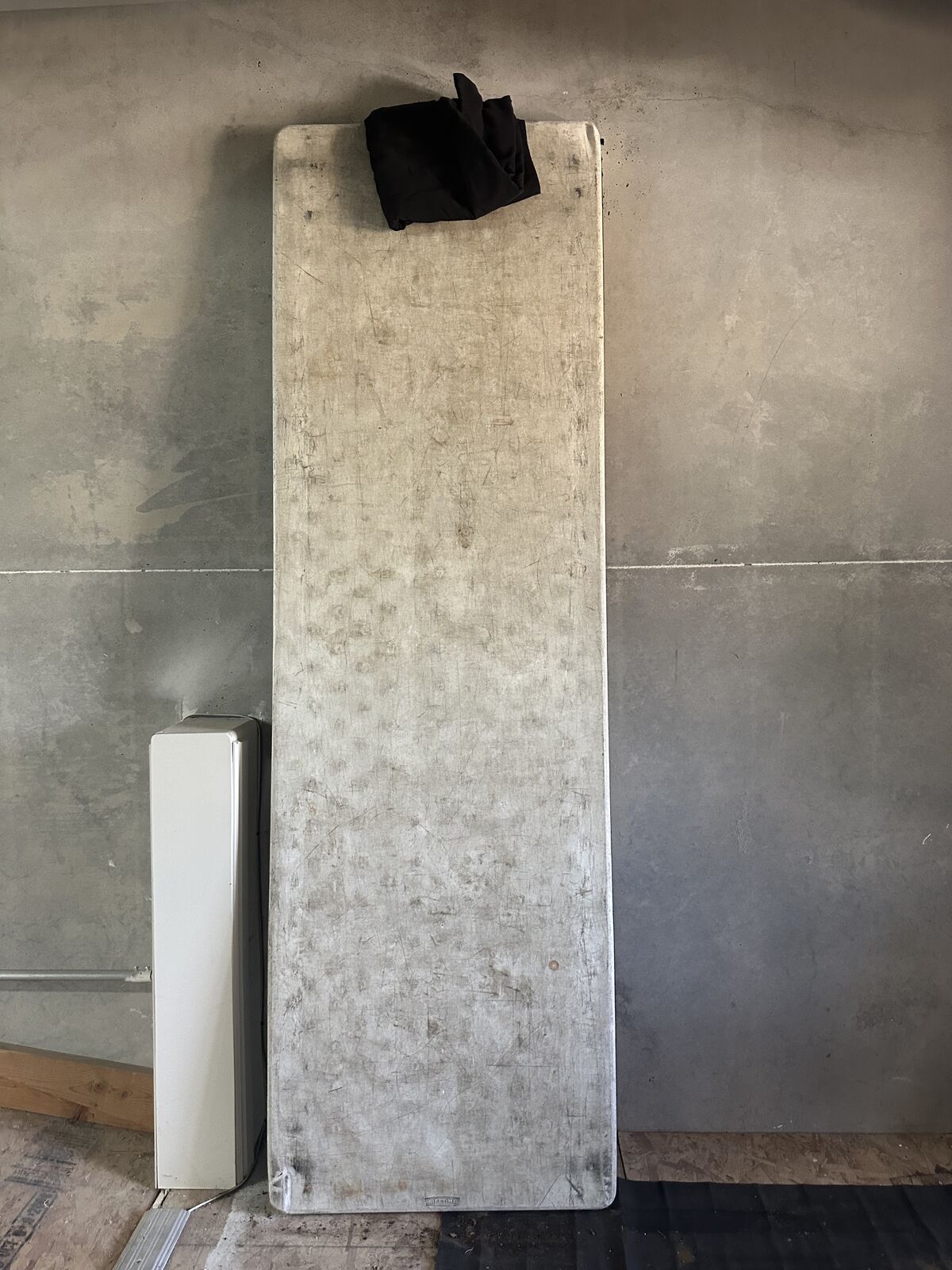 8 FT TABLE WITH FOLDING LEGS,  BLACK TABLE CLOTH INCLUDED