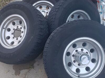 8 LUG WHEELS 16" X 8" WITH TIRES.