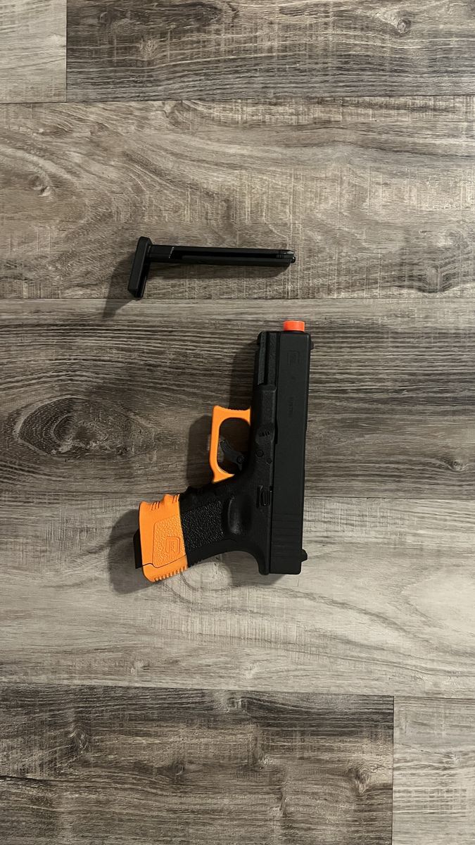 Glock 19 Gen3 CO2 Airsoft Pistol - SB199 Compliant with Orange Accents