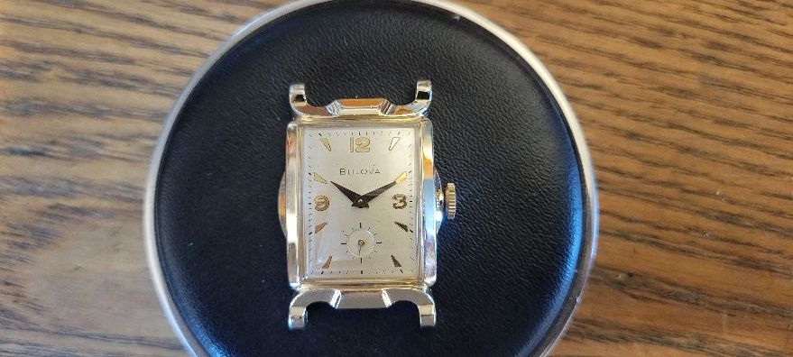 Selling a used vintage BULOVA wristwatch in a yellow gold-filled case and stainless-steel case back