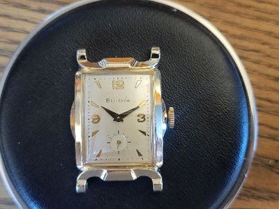 Selling a used vintage BULOVA wristwatch in a yellow gold-filled case and stainless-steel case back