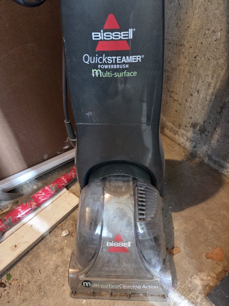 Bissell QuickSteamer Powerbrush Multi-surface Carpet Cleaner,  cooler on wheels. 