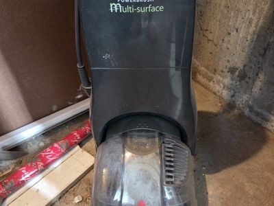 Bissell QuickSteamer Powerbrush Multi-surface Carpet Cleaner, cooler on wheels.