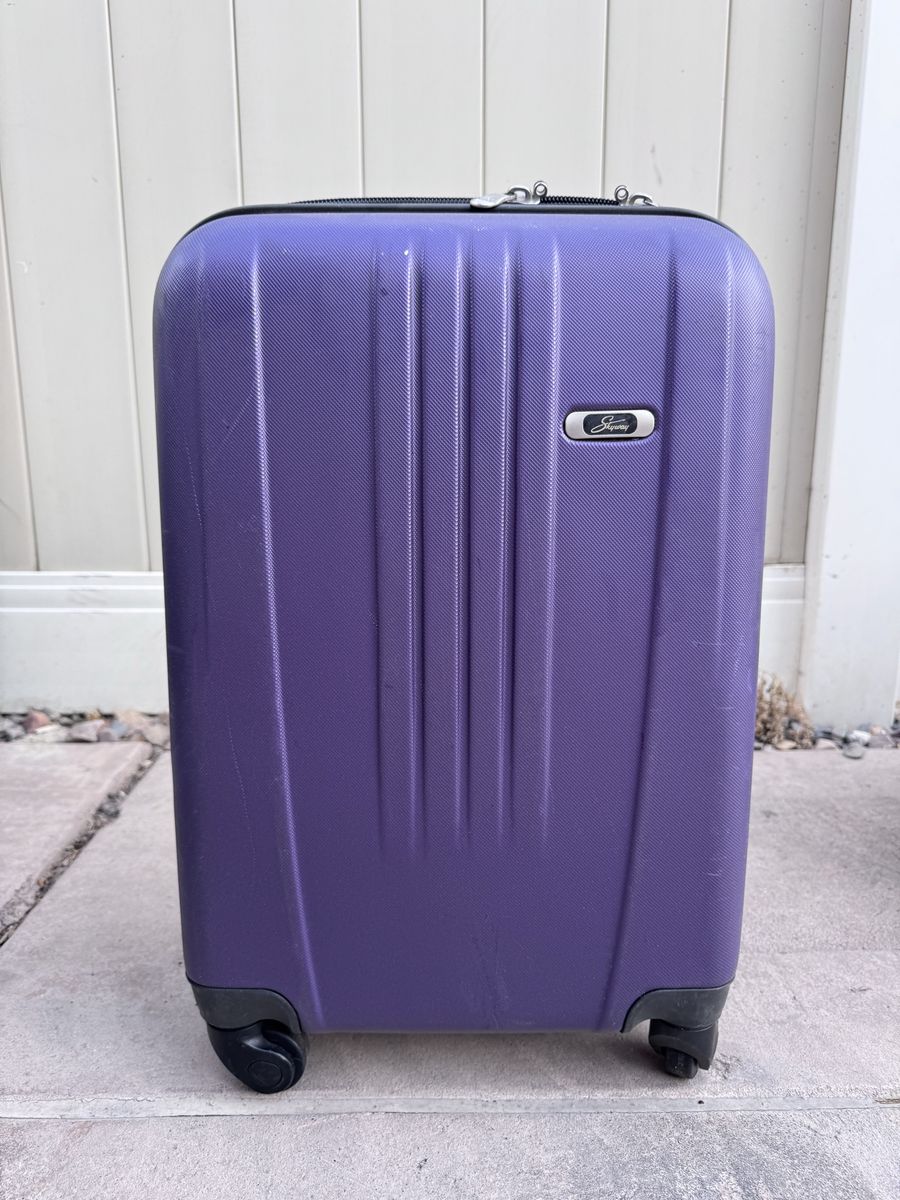 Skyway Luggage Co. Purple Hardside Carry-On Suitcase with Spinner Wheels