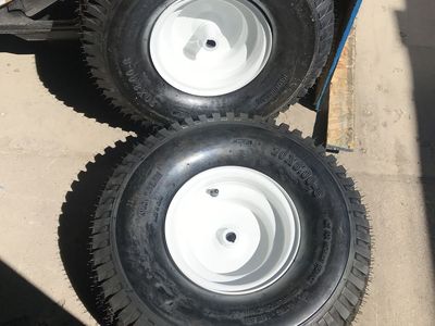 Two brand new riding lawn Mower tires and rims 20 x 8 x 8 tires