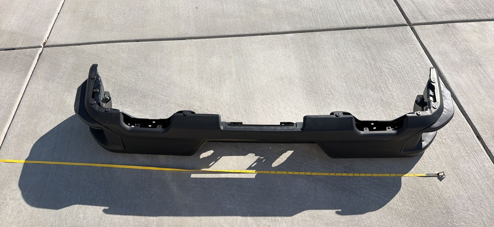 Chevrolet Rear Bumper - Black, Plastic