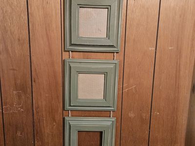 3 wood picture frames strung together with rope