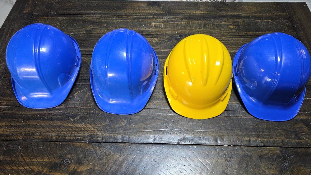 Safety Gear Lot: Hard Hats (Blue, Yellow) & Reflective Vests (High-Vis Green, Orange)