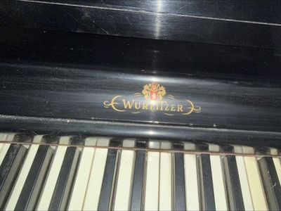 Wurlitzer Black Upright Piano - Damaged Finish, Needs Repair