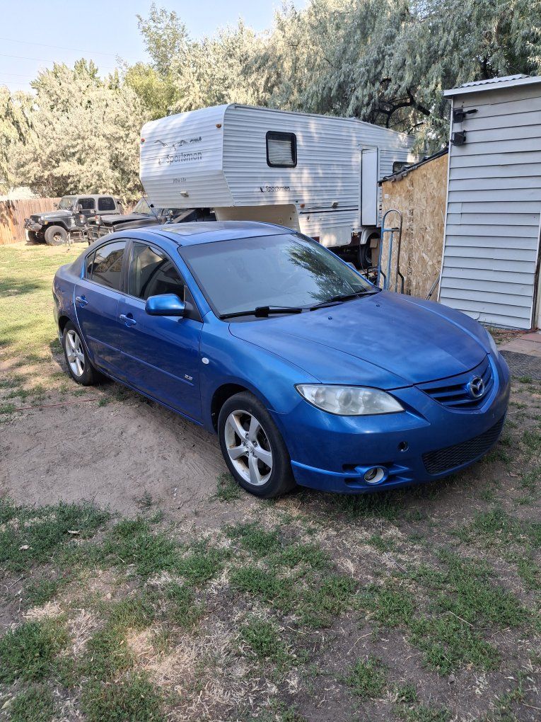 Blue Mazda 3 Sedan 2.3L 4-Cylinder DOHC 16-Valve