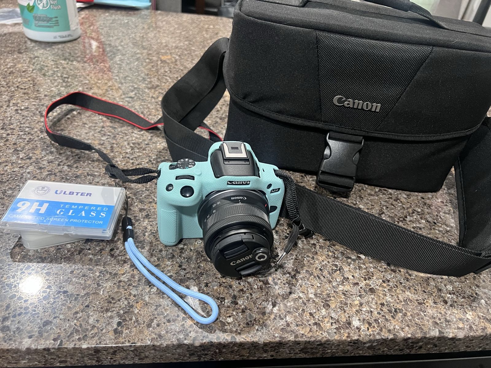 Canon EOS R50 Mirrorless Camera with 18-45mm Lens (Black) Bundle with 64GB Memory Card + Canon 200ES EOS Shoulder Bag.