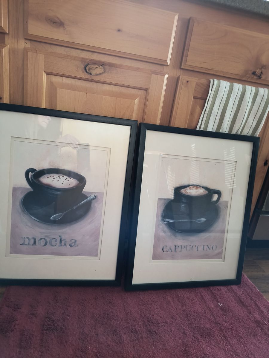 Two framed prints.