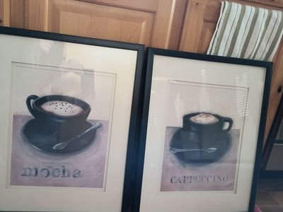 Two framed prints.