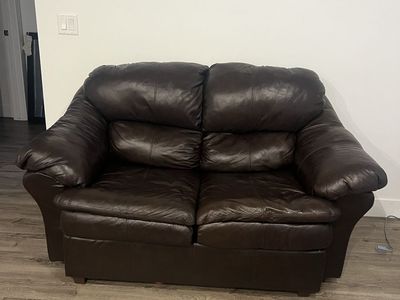 Brown leather loveseat